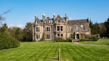 Balinakill Country House – Victorian mansion with castellated roofline set in manicured grounds and woodland