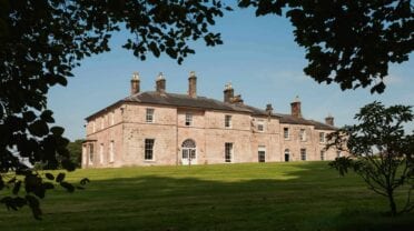 Dabton House, Dumfries and Galloway – Sandstone country house with multiple chimneys set in manicured lawns and mature trees
