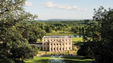 Benham Park, Hampshire – Cream-painted country house with river, parkland and tree-lined grounds.