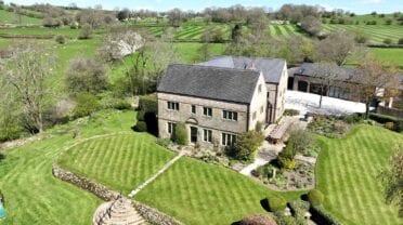 Stainsborough Hall, Derbyshire – Stone country house with manicured lawns and surrounding rural countryside views.